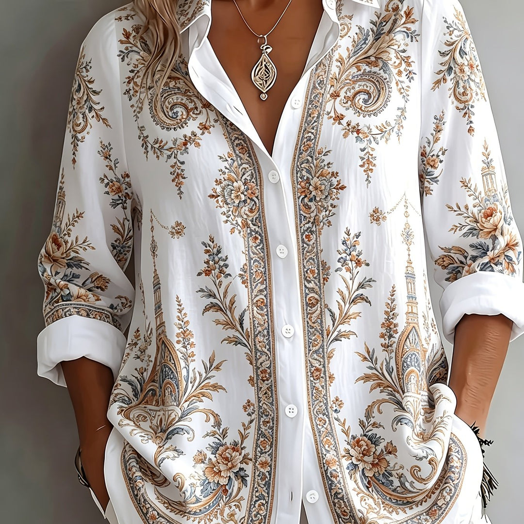 Casual button-down women's shirt, long sleeve, featuring a vibrant floral paisley print.