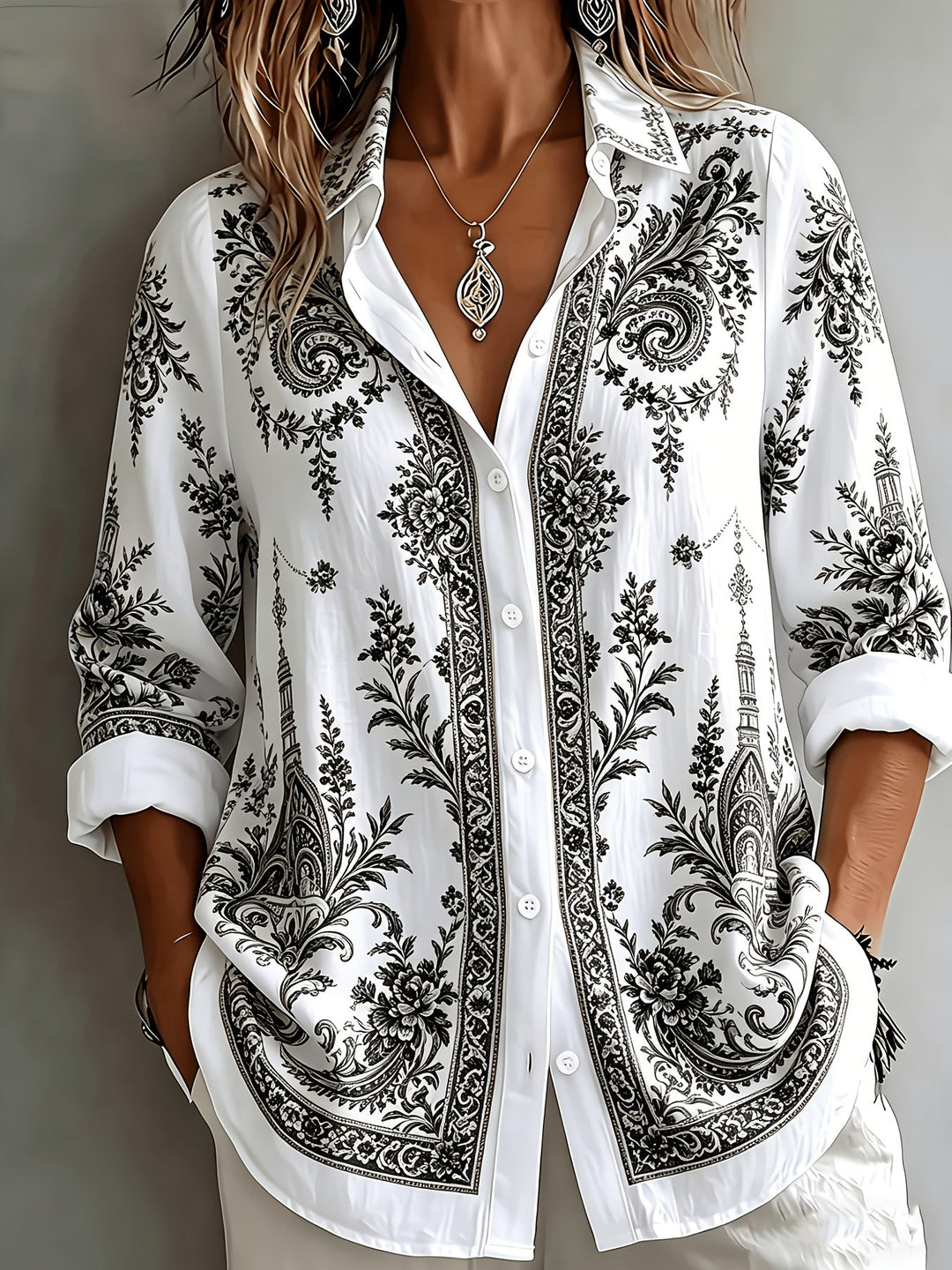 Casual women's long sleeve blouse with vibrant floral and paisley print design.