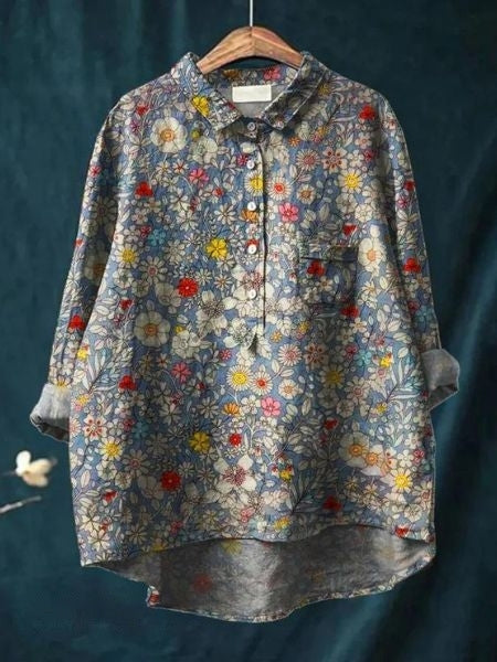 Plus size women's floral button-up blouse. Long sleeve casual top for comfortable everyday wear.
