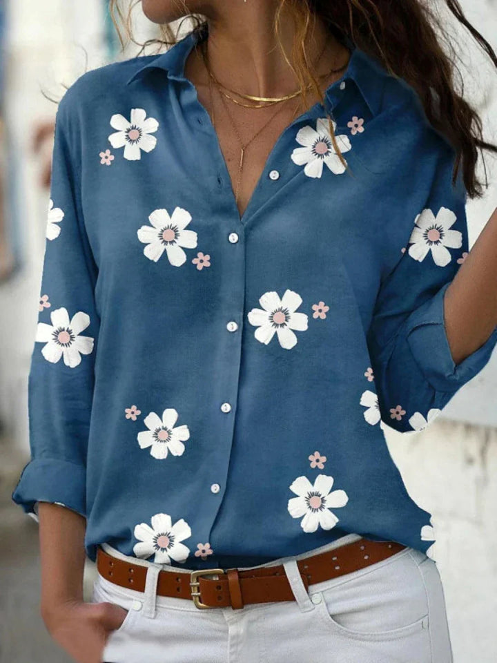 Versatile women's floral button-front blouse. Features long sleeves and a collar, great for spring casual outfits.