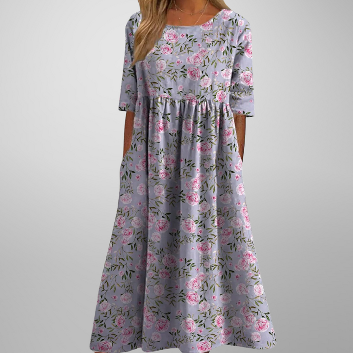 Women's short-sleeve midi dress with a delicate floral print, gathered waist, and ultra-comfortable relaxed fit.
