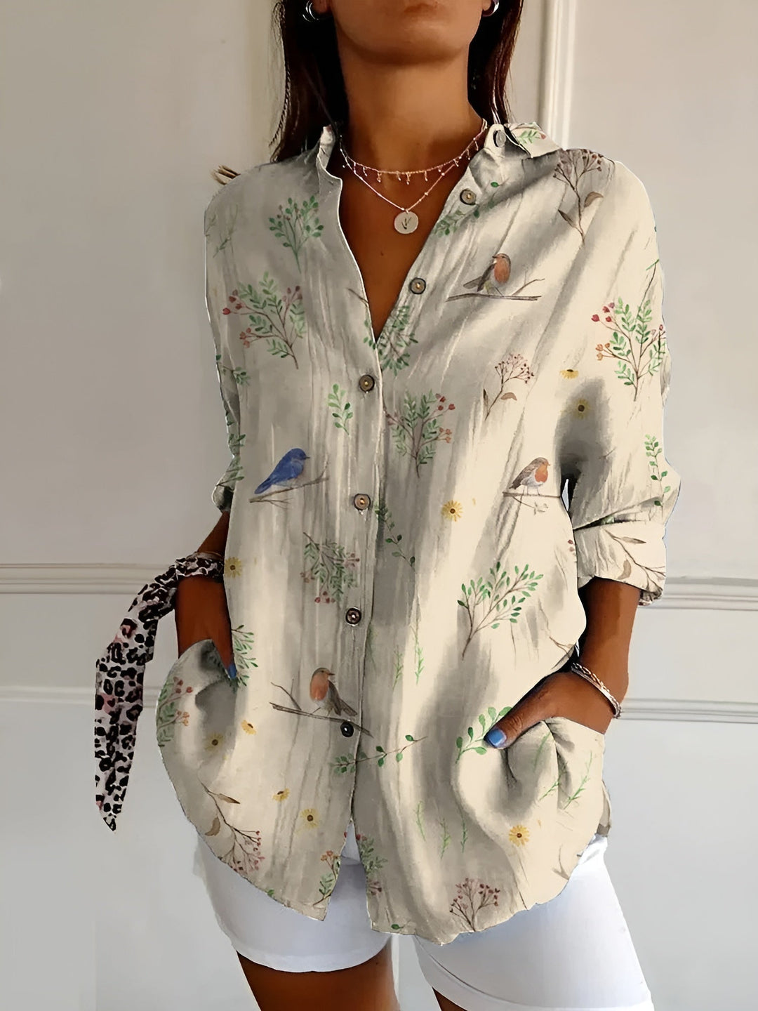 Women's summer fashion: oversized floral print button-down top with a breathable relaxed fit. Everyday wear.