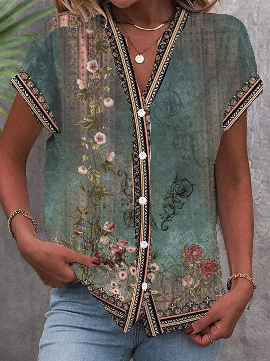 Women's floral print V-neck blouse, ideal for spring & summer. Relaxed fit, cap sleeves, boho chic style.