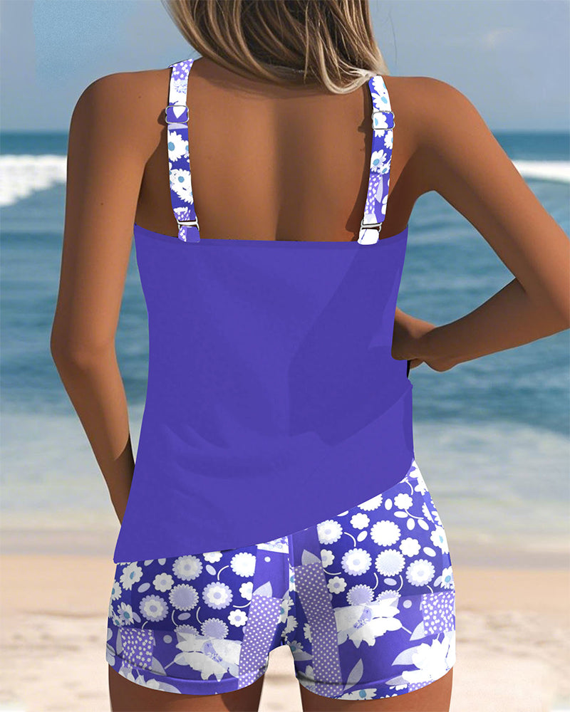 Modest women's floral print racerback tankini and boyshorts, ideal for beach or pool days.