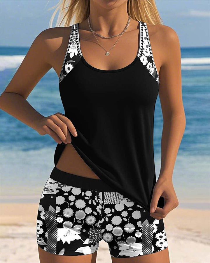 Comfortable women's floral racerback tankini set with supportive boyshorts for summer activities.