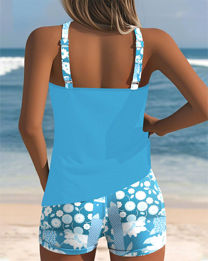 Women's two-piece floral print racerback tankini & boyshorts, excellent for summer active swim.