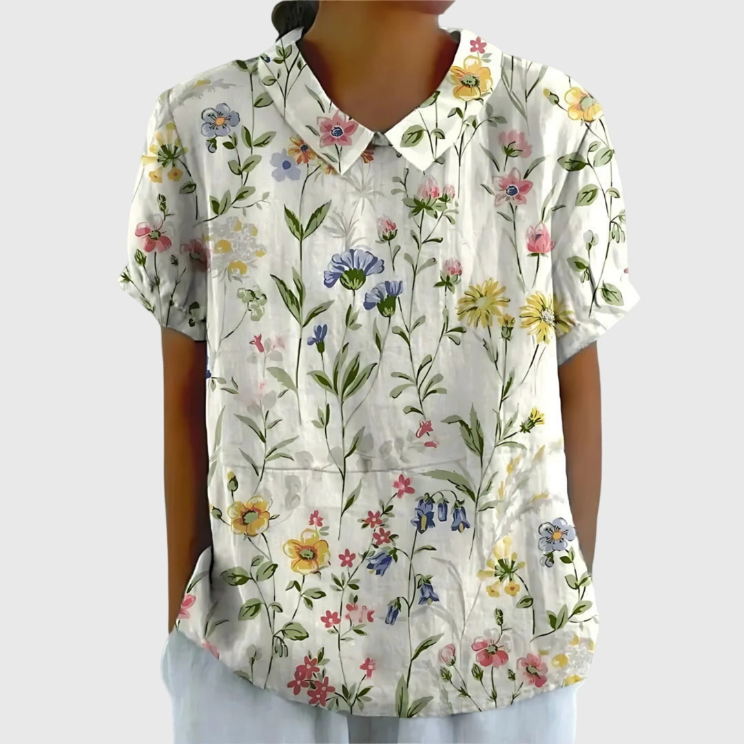 Women's floral short sleeve blouse, Peter Pan collar, perfect for warm weather and effortless style.