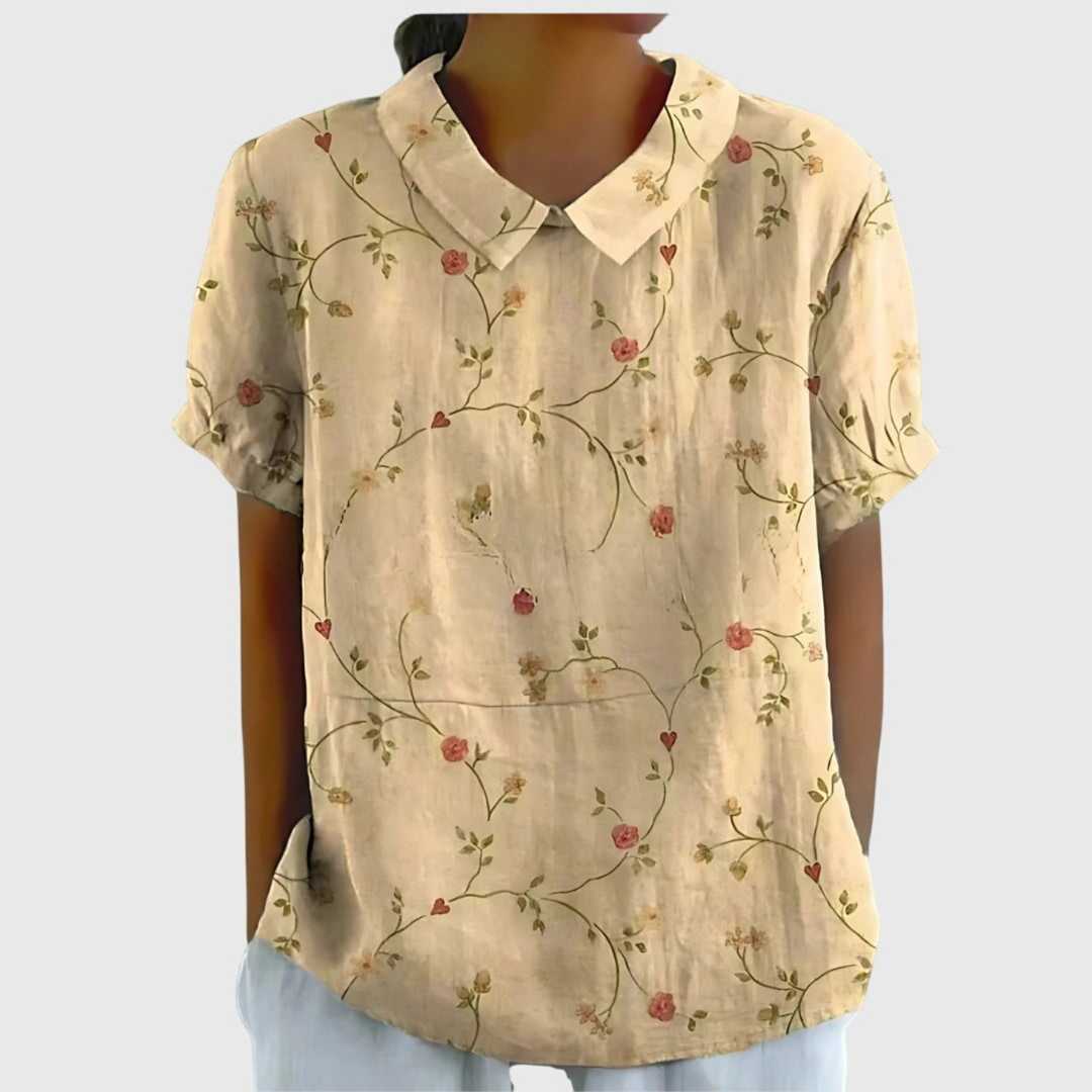 Fashionable women's floral short sleeve blouse, collared, ideal for stylish summer casual wear and everyday comfort.