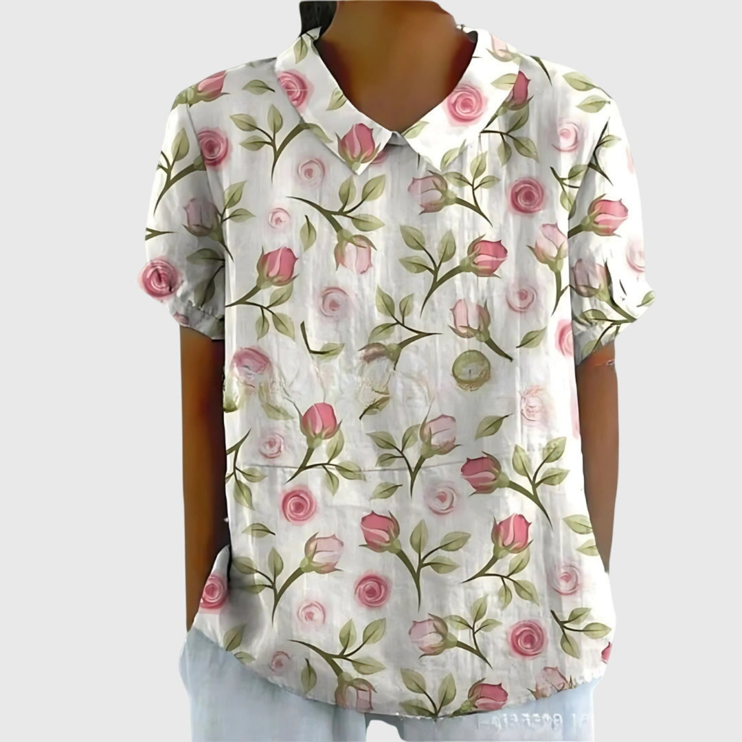 Breathable women's floral short sleeve blouse in a relaxed fit, featuring a stylish Peter Pan collar for summer comfort.