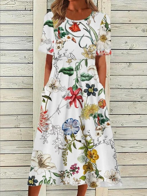 Elegant women's floral midi dress with short sleeves & a round neck. Flowy, comfortable day dress for spring/summer.