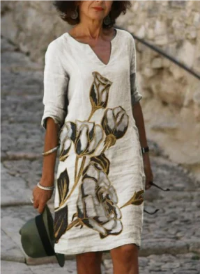 Comfortable V-neck floral midi dress for women, adorned with a stylish artistic face design