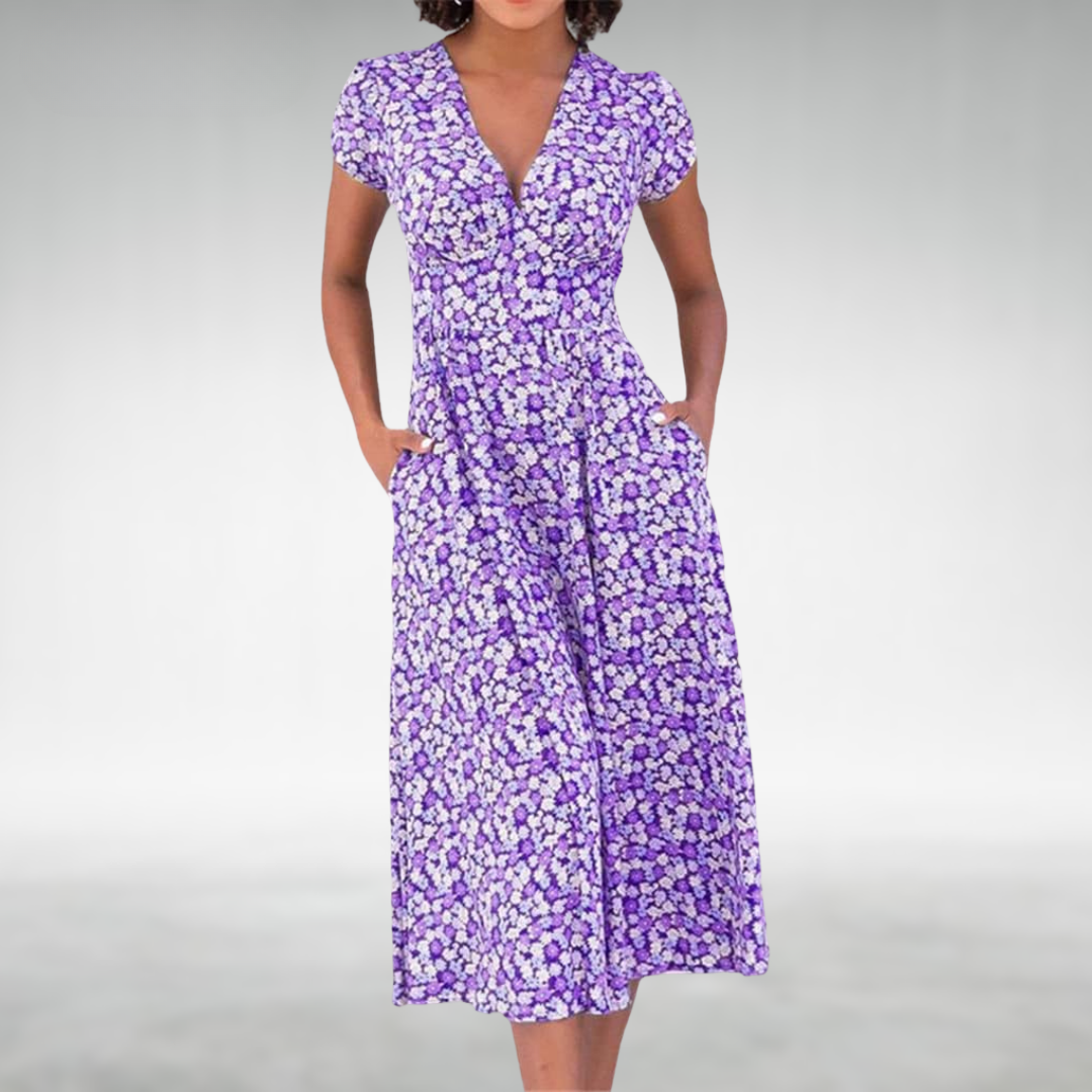 Casual women's midi dress in a vibrant floral print, styled with a sophisticated V-neck and pockets.