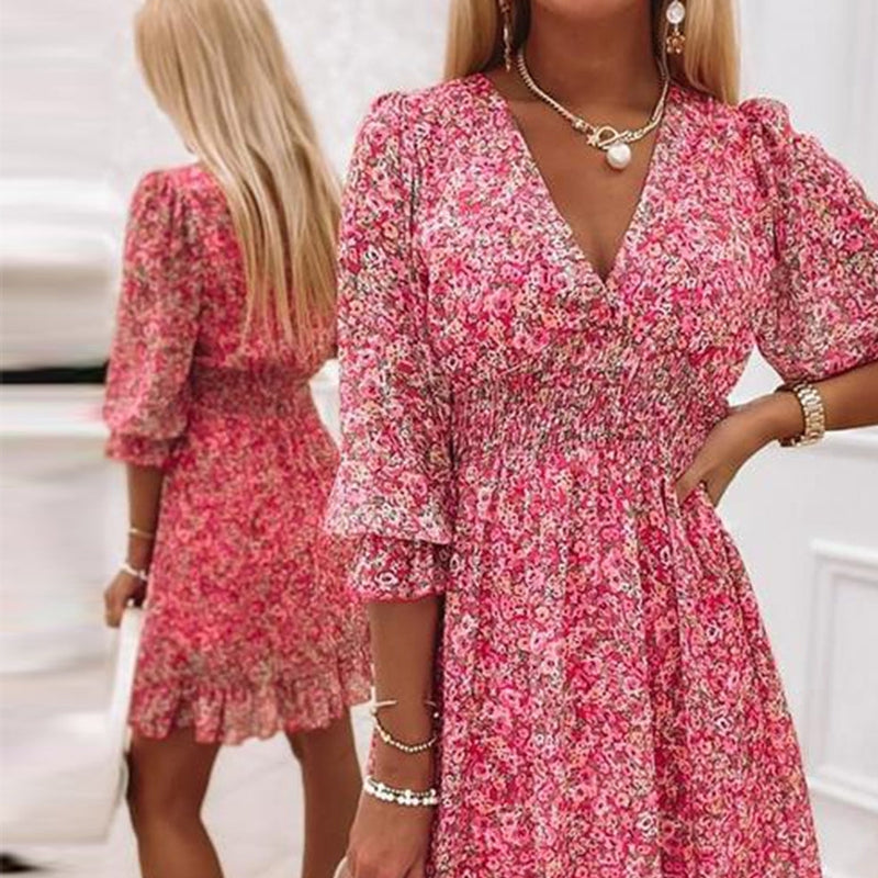 A-line floral mini dress for women featuring a stylish V-neck and puff sleeves.
