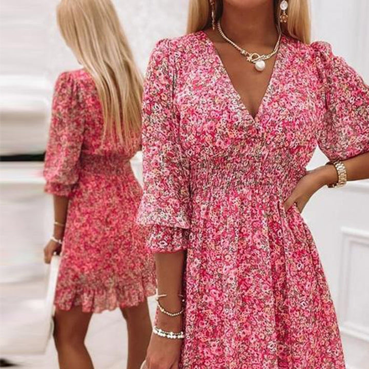 A-line floral mini dress for women featuring a stylish V-neck and puff sleeves.
