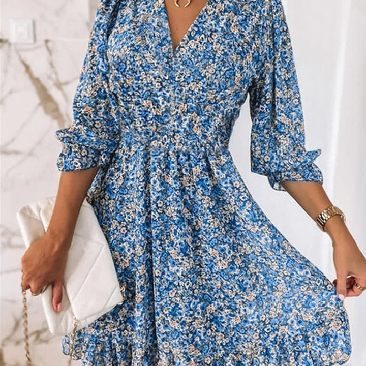 Chic women's polyester floral mini dress with flattering V-neck and trendy puff sleeves.