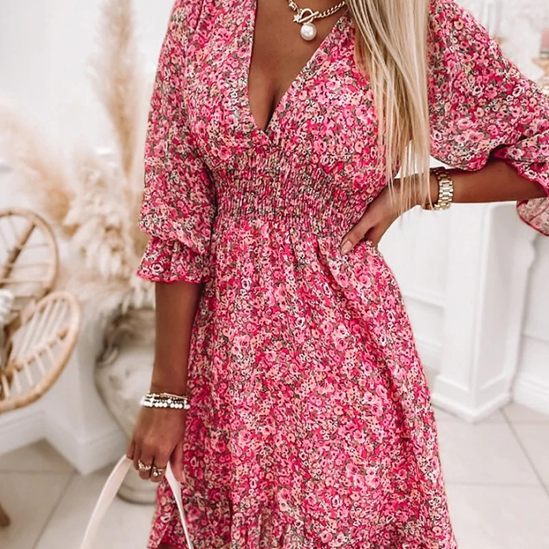 On-trend women's fashion floral A-line mini dress with V-neck and puff sleeves detail.