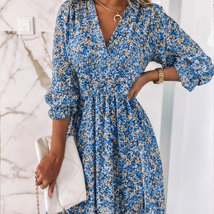 V-neck floral mini dress for women, featuring puff sleeves, ideal for casual occasions.