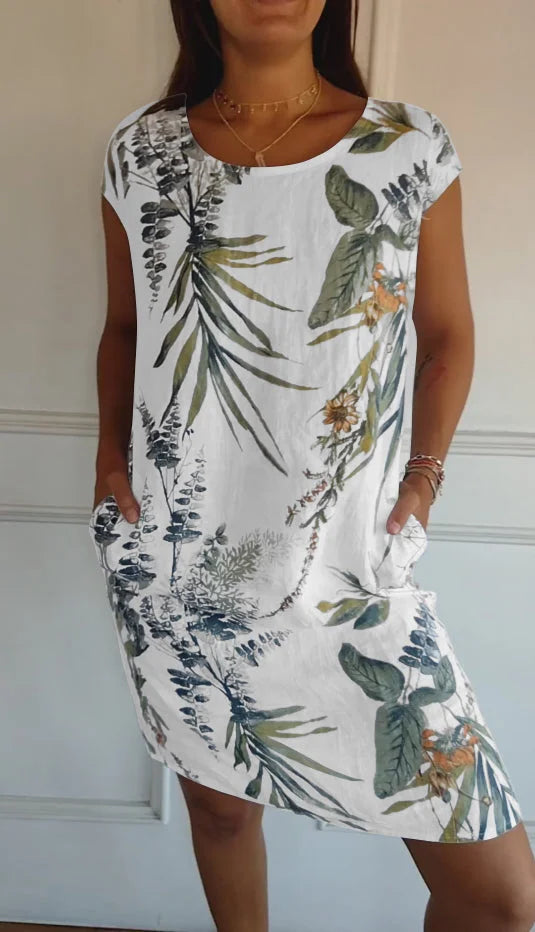 Women's flowing printed round neck dress, knee-length & loose fit, perfect for casual summer elegance.