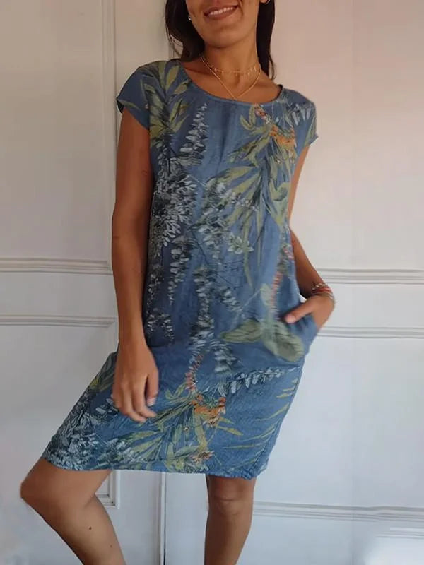 Comfortable women's printed dress with round neck. Flowing, knee-length for versatile day-to-night wear.