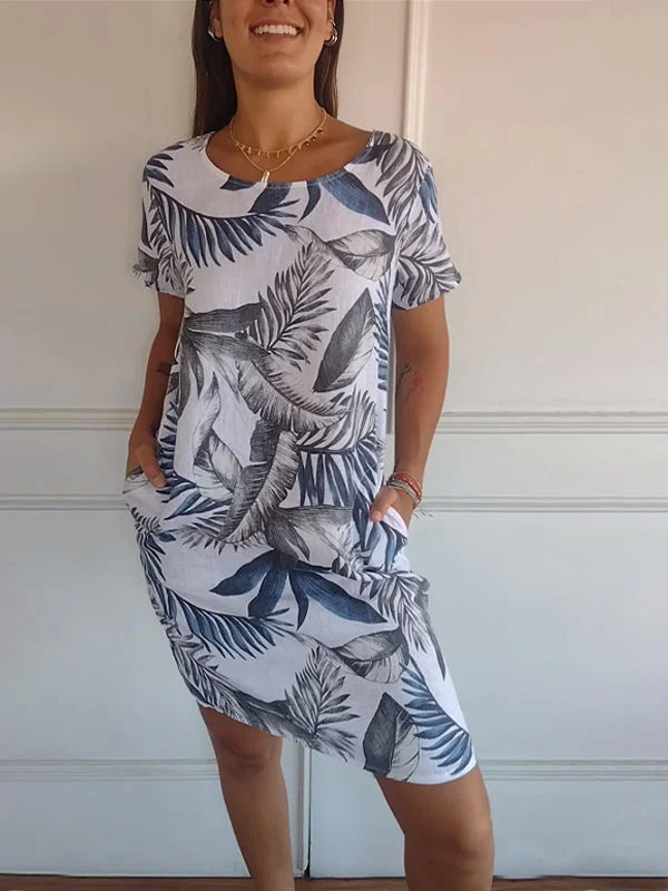 Casual yet chic women's flowing dress with a distinctive print and round neckline, ideal for summer.