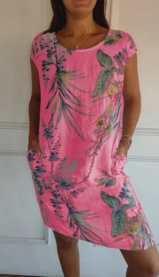 Versatile knee-length printed dress for women. Features a comfortable loose fit and round neck, easy care.