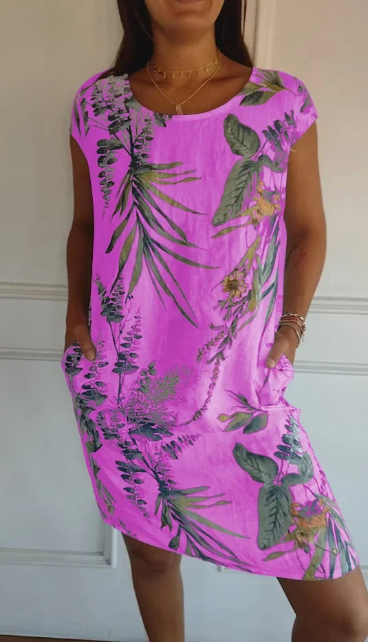 Summer fashion women's dress. Flowing fabric, round neck, and a stylish print create an elegant look.
