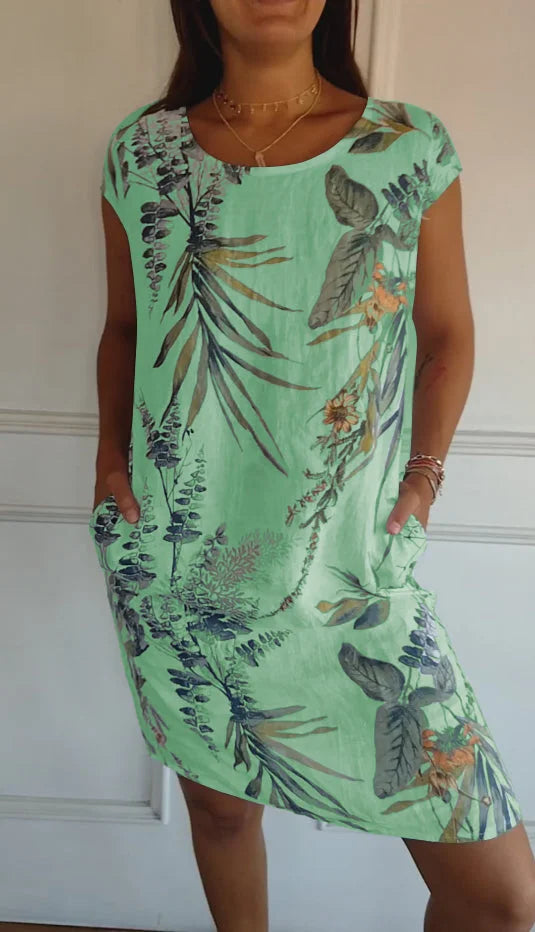 Women's patterned dress with a round neck and loose, flowing fit. Perfect for comfort and style, day or night.
