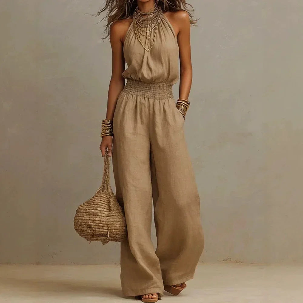 Women's flowing wide leg halter neck jumpsuit, perfect for elegant summer fashion or comfortable casual wear.