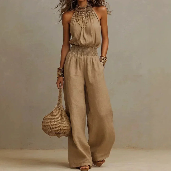 Women's flowing wide leg halter neck jumpsuit, perfect for elegant summer fashion or comfortable casual wear.