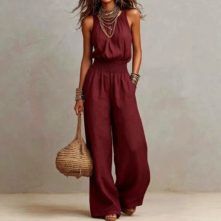 Stylish women's wide leg jumpsuit with a chic halter neck, perfect for elegant summer fashion and comfort.