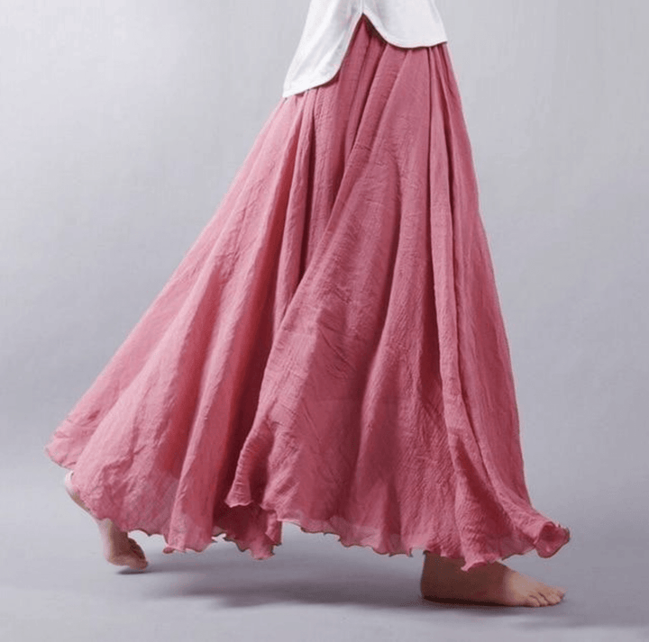 Elegant women's flowy maxi skirt with a chic A-line cut, perfect for resort wear or stylish summer fashion.