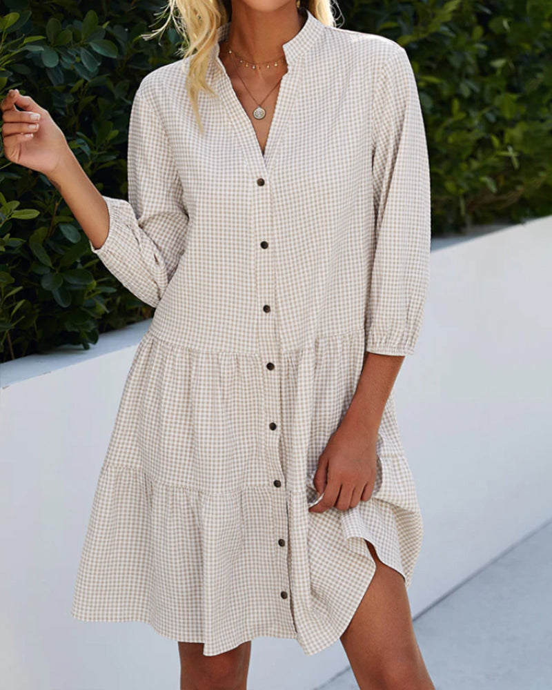 Casual women's midi dress: a flowy A-line summer design with a charming check pattern for everyday style.