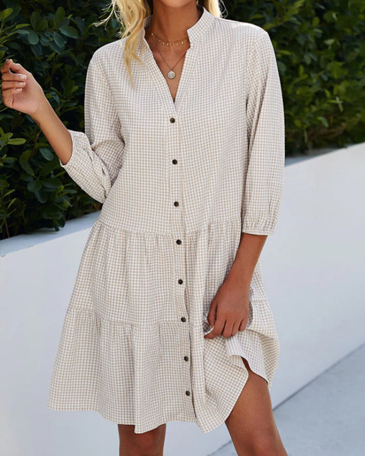 Casual women's midi dress: a flowy A-line summer design with a charming check pattern for everyday style.