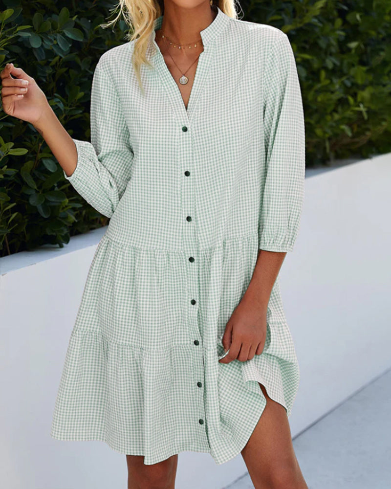 Chic women's flowy A-line summer dress. Stylish check pattern, perfect for casual outings and everyday comfort.