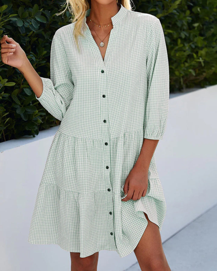 Chic women's flowy A-line summer dress. Stylish check pattern, perfect for casual outings and everyday comfort.