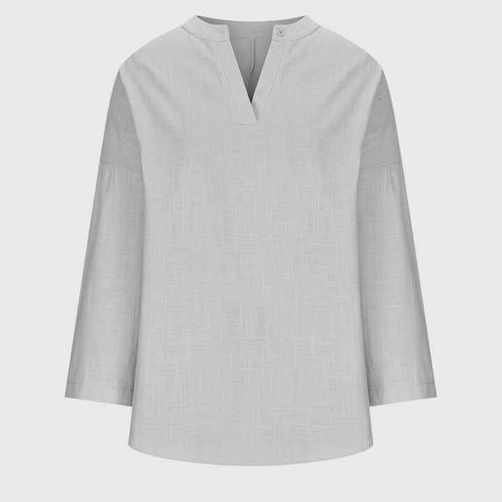 Versatile women's flowy long sleeve shirt, an elegant beach top for casual, chic summer style.