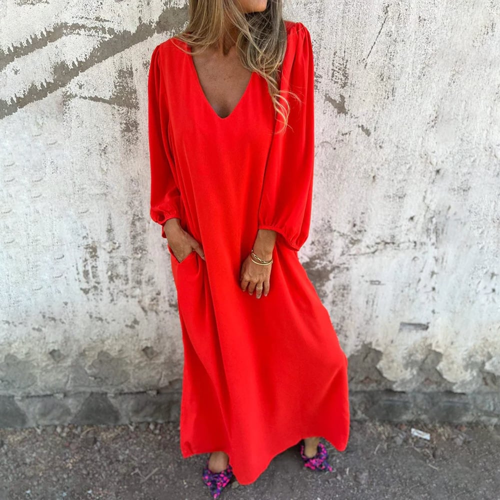 Elegant women's flowy V-neck maxi dress with balloon sleeves & pockets. Ideal as a versatile casual or party dress.