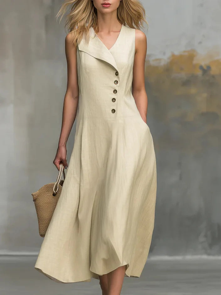 Women's flowy midi dress with button detail and V-neck, perfect for casual summer style. Relaxed fit.
