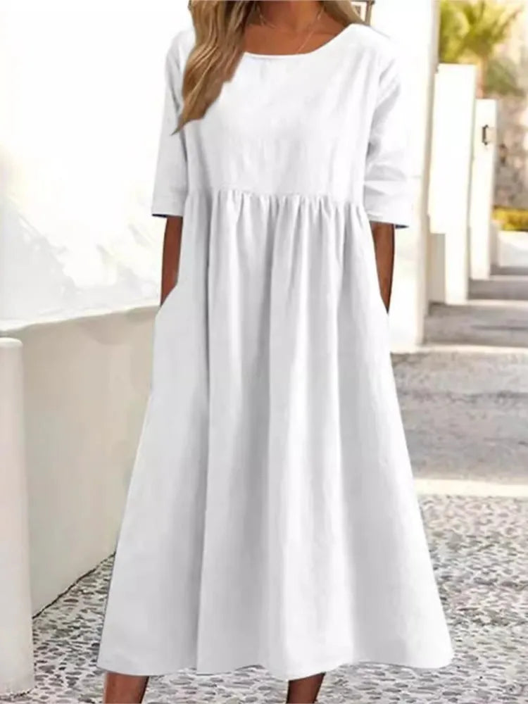 Soft, comfortable women's flowy midi dress. Features a classic round neck & short sleeves, perfect for summer casual.