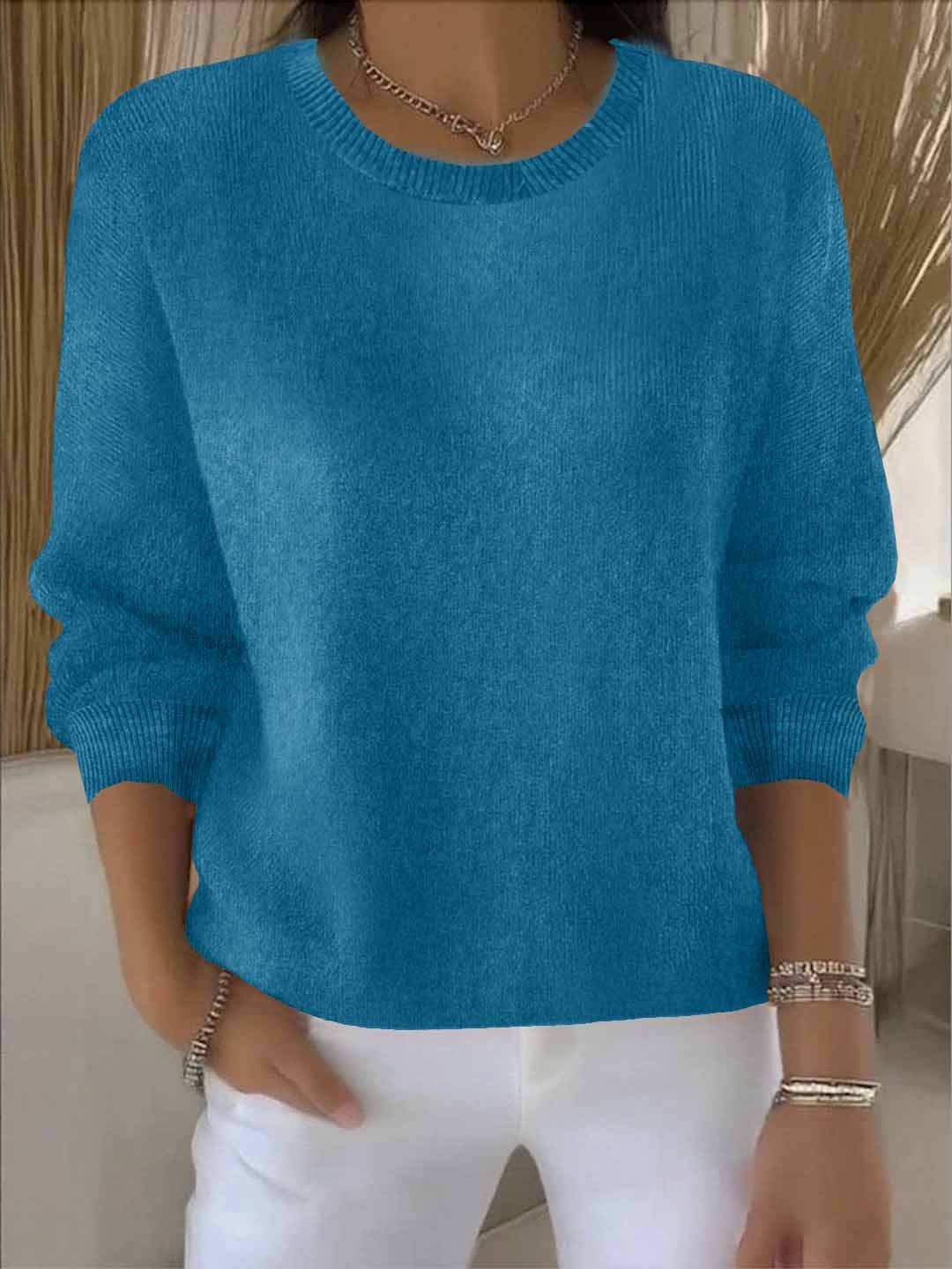 Flowy relaxed fit women's sweater displayed, a versatile casual chic top for autumn/winter.