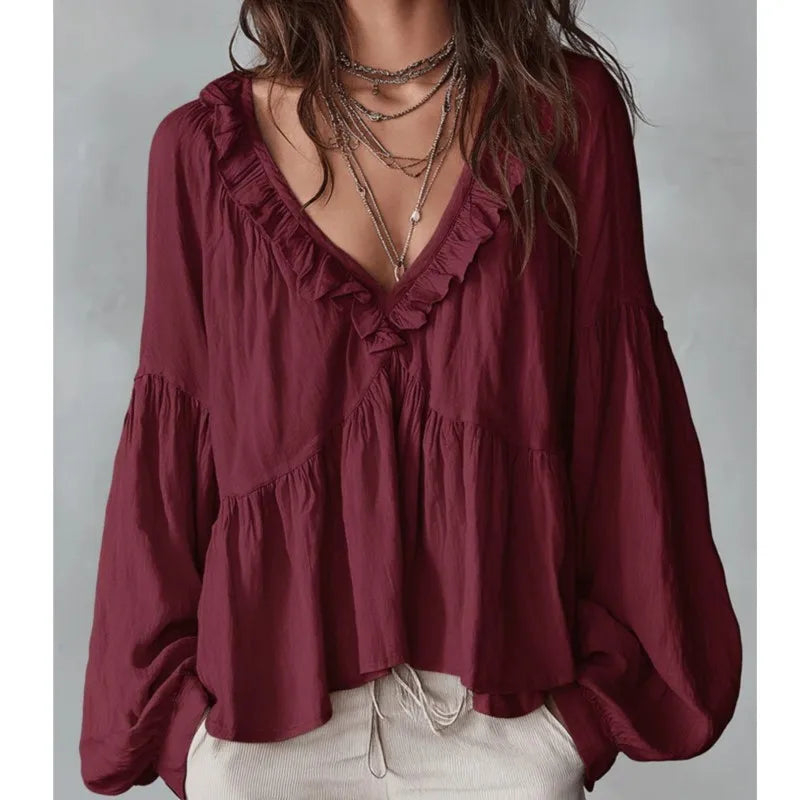 Effortless women's V-neck ruffle blouse with puff sleeves, a loose-fit and comfortable top for elegant ladies' summer style.