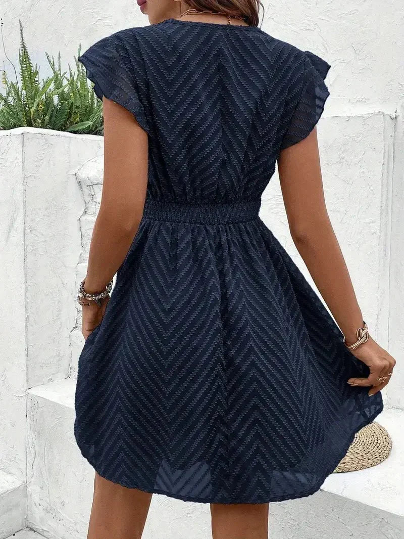 Elegant women's flutter sleeve V-neck mini dress, a chic party dress with a sophisticated flared skirt design.
