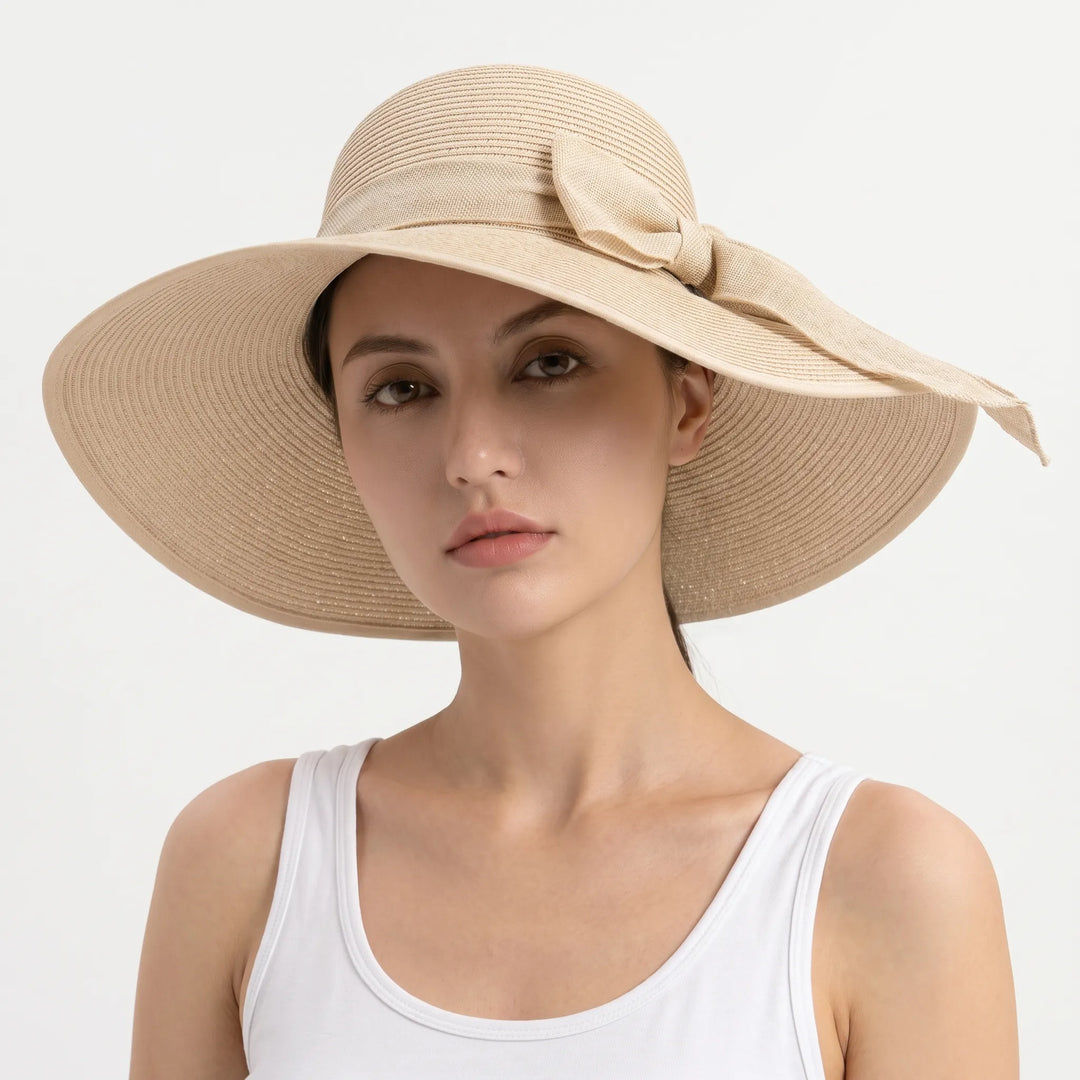 Foldable wide brim sun hat for women, ideal travel accessory for beach trips and summer vacations.