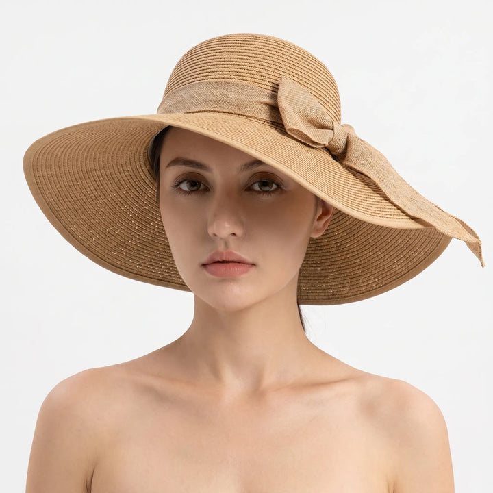Lightweight women's foldable wide brim sun hat. A chic travel accessory for beach, pool, and summer activities.
