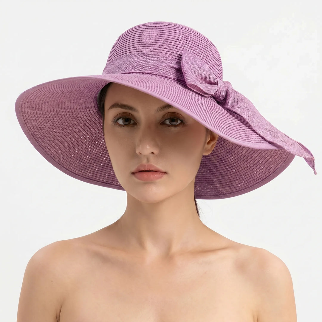 Elegant women's foldable wide brim sun hat, ideal for travel. Perfect beachwear and a stylish summer accessory.