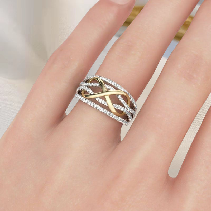 View of a women's silver alloy 'Forever Linked' mother daughter ring, with a sparkling gemstone accent