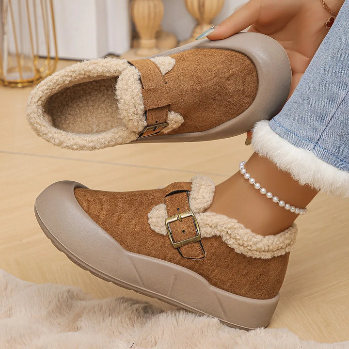 Women's cozy black leather mules with buckle, fleece lining, soft and comfortable for daily wear.