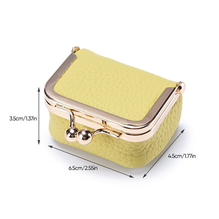 Compact women's leather jewelry box, mini travel organizer designed for rings, earrings, and necklaces.