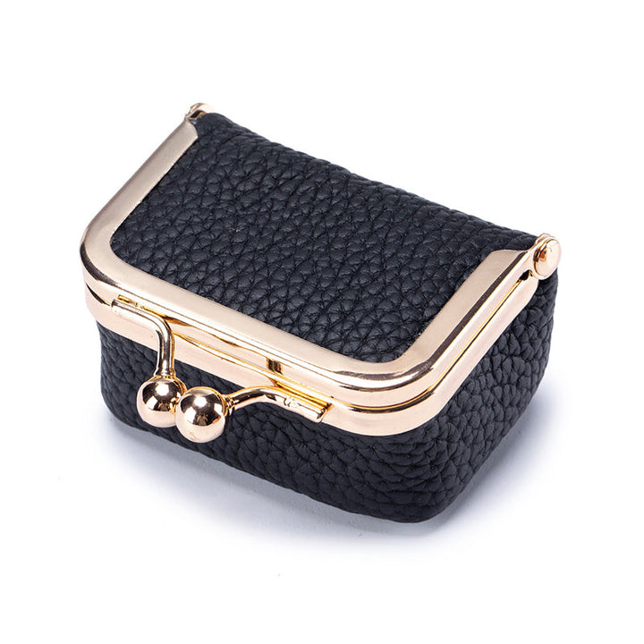 Portable genuine leather mini jewelry box, perfect for women to organize rings, earrings, and small treasures.
