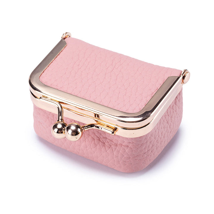 Miniature genuine leather jewelry box for women, perfect for keeping rings, earrings, and small accessories secure.